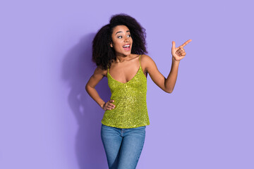 Photo of adorable lcheerful woman wear stylish clothes introduce banner empty space isolated on violet color background