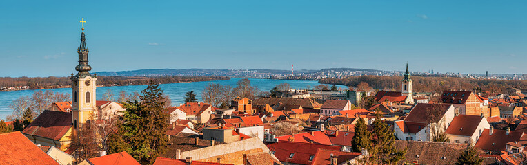 Explore Belgrade's scenic skyline with its iconic red rooftops and historic landmarks, including the belfry and cathedral, offering a picturesque view of the cityscape. - 786490923