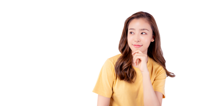 Surprised happy beauty asian woman looking copy space in excitement. Expressive facial expressions. Presenting some product. Beautiful girl look at blank space Isolated on yellow background	