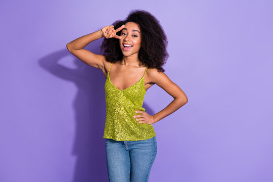 Photo of adorable cute positive woman wear trendy clothes hand showing v-sign isolated on violet color background