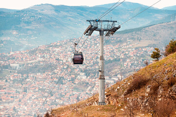 Concept of sightseeing, the cable car offers a convenient and enjoyable way to explore Sarajevo's mountainous terrain during summer vacation. - 786495546