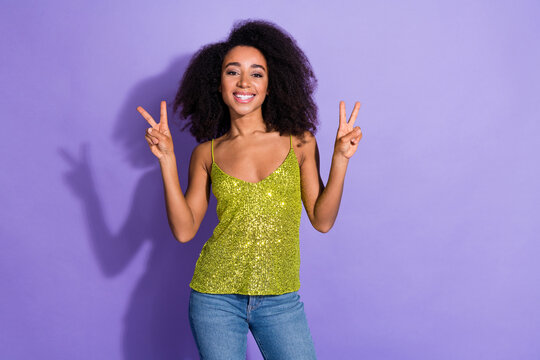 Photo of nice glad lovely woman wear stylish clothes hand showing v-sign isolated on violet color background