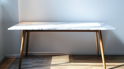Fototapeta na wymiar Marble table with wooden legs in front of white wall with sunlight on the floor.