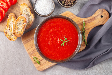 Tomato soup or sauce with rosemary.  Healthy, vegan and dieting lunch and dinner concept. Gazpacho. 