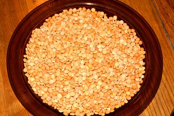 On the plate shelled peas halves , legumes - quality control , selecting defective seeds and getting rid of stones