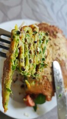 close up of a slice of wild garlic pancakes