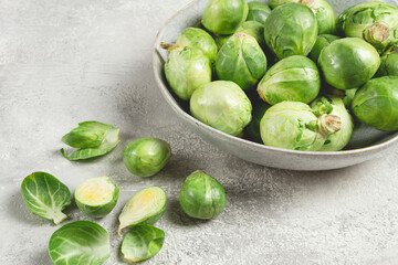 fresh Brussels sprouts, raw, top view, on a gray table, no people,