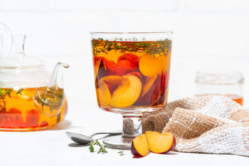 flavored black tea with plums, berries and thyme, closeup