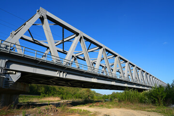 Metal structure of a railway bridge over Mures river in Arad county, Romania, Europe - 786515717