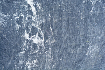 Detail of a dark stone exterior garden path tile surface