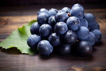 Blue grapess on wooden background. Fresh Blue grapes fruits