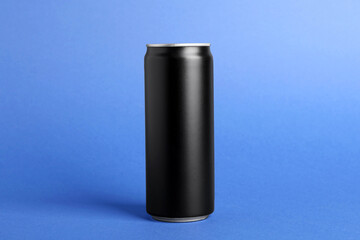 Energy drink in black can on blue background