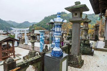Fototapeta na wymiar Tozan Sueyama shrine by porcelain pillar and torii gate, Imari