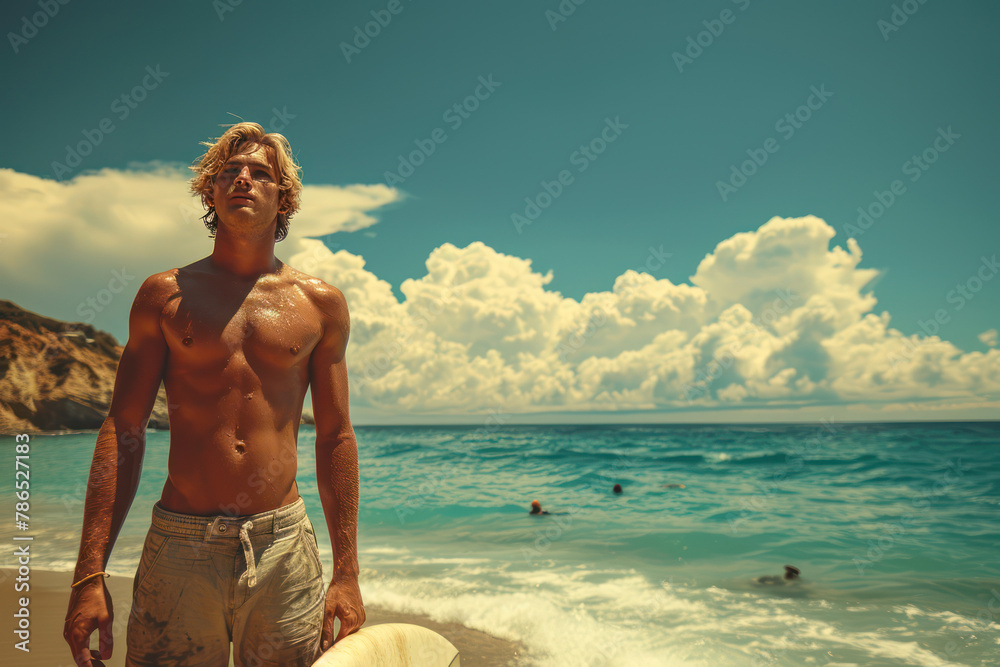 Wall mural handsome blonde california surfer is enjoying his outdoor activity on the beach along the coast line under the sunny California sun