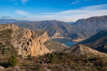Embalse de Canales Reservoir in Guejar Sierra, province of Granada, Andalusia, Spain. Picturesque landscape view above. Spain. Sierra Nevada mountains.