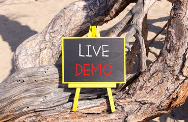 Live demo symbol. Concept words Live demo on beautiful black yellow blackboard. Beautiful tree...