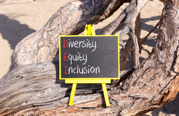 DEI diversity equity and inclusion symbol. Concept words DEI diversity equity inclusion on blackboard. Beautiful old tree background. Business DEI diversity equity and inclusion concept. Copy space.