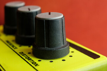 Macro image of guitar pedal.