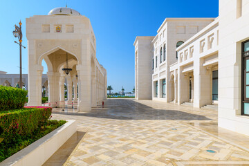 The white marble facade and decorated courtyard at the entrance to Qasr Al Watan, the Royal Presidential Palace in Abu Dhabi, United Arab Emirates.