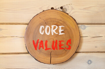 Core values symbol. Concept words Core values on beautiful wooden circle. Beautiful wooden wall...