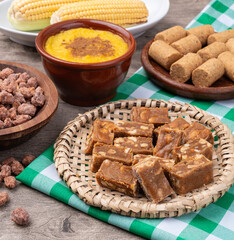 Typical brazilian june festival food over plaid fabric. Festa junina