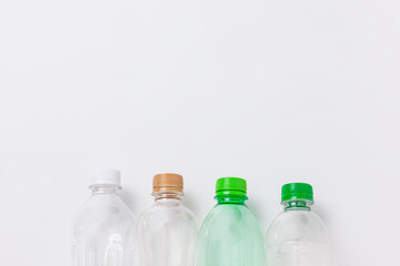 Assorted plastic bottles placed on a white background.