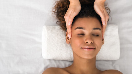 Lady in a serene spa head massage moment
