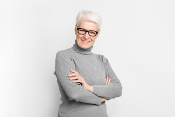 Senior European lady posing with crossed arms