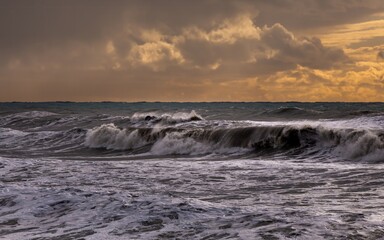 storm at sea, dramatic sky at sunset, big waves