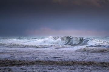 storm at sea, dramatic sky at sunset, big waves