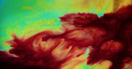 Ink spill. Shiny fluid texture. Blur red green cyan yellow color sparkling glitter particles water...