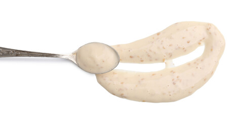 Spoon with fresh marinade isolated on white, top view