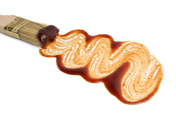 Basting brush with fresh marinade isolated on white