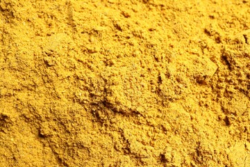 Dry curry powder as background, above view