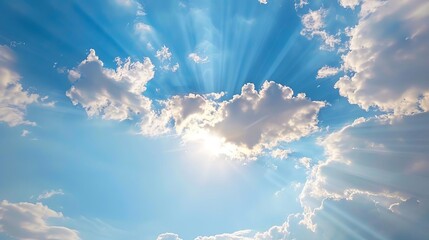 sunbeams breaking through clouds in blue sky natural light phenomenon - obrazy, fototapety, plakaty