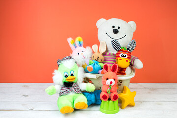 Collection of colorful toys on an orange background. Kids toys.