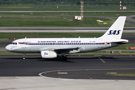 Dusseldorf, Germany - April 26, 2011: Scandinavian Airlines SAS Airbus A319-100 with registration OY-KBO in special retro livery on taxiway at Dusseldorf Airport