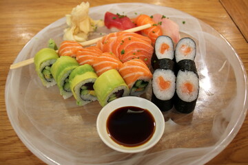 Table in a restaurant with a variety of
  snacks and food.