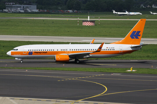 Dusseldorf, Germany - May 13, 2012: German TUIfly Boeing 737-800 with registration D-ATUF in special Hapag-Lloyd Kreuzfahrten livery on taxiway at Dusseldorf Airport