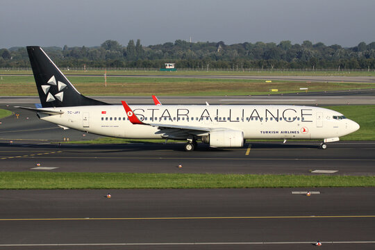 Dusseldorf, Germany - September 3, 2011: Turkish Airlines Boeing 737-800 with registration TC-JFI in Star Alliance livery on taxiway at Dusseldorf Airport