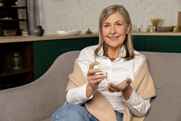 Smiling good-looking woman with blood sugar testing stick