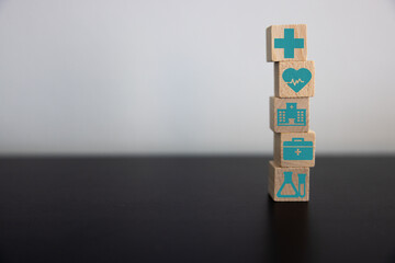 Health Insurance Concept, Reduce Medical Expenses, Hand flip wood cube with icon healthcare medical...