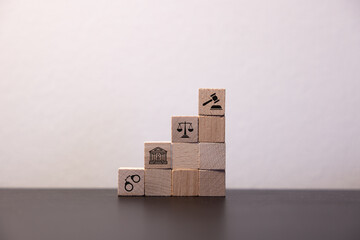 Concept of compliance with icons on wooden cubes law concept