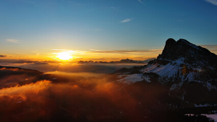 Rocky snow mountains and sunrise sun - 786589752