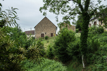 typical landscape of the French region of the Morvan with an old farmhouse