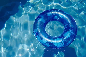 Foto op Plexiglas Top view of blue floating tire in water in swimming pool © Firn