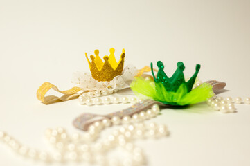 Toy crown and pearl necklace	