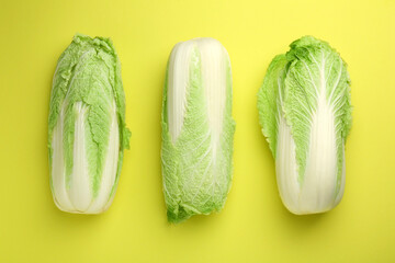 Fresh ripe Chinese cabbages on green background, top view