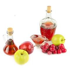 Apple vinegar and wine in glass bottle and ripe apples and grapes isolated on white. There is free space for text. Collage. - 786601375