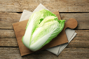 Fresh ripe Chinese cabbage on wooden table, top view - obrazy, fototapety, plakaty